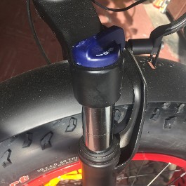 Shocks on tire with blue cap